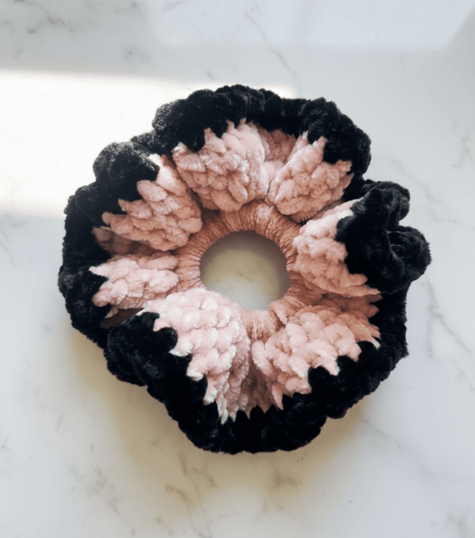 Petal Black Chenille Scrunchie on marble surface